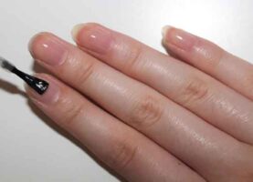 What is a base coat used for in manicure?